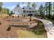 Beautiful two-story home featuring a welcoming front porch, gray siding, landscaping, and a long driveway at 2841 Bettis Ct, Marietta, GA 30066