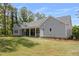 Back exterior view of a light gray home with a covered porch and well-manicured lawn at 2841 Bettis Ct, Marietta, GA 30066