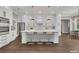 Modern kitchen with stainless steel appliances, white cabinets, and a large island with seating at 2841 Bettis Ct, Marietta, GA 30066