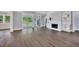 Open-concept living room with hardwood floors, fireplace, built-ins, and sliding glass doors to patio at 2841 Bettis Ct, Marietta, GA 30066