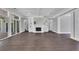 A spacious living room offers a fireplace, built-in shelving, and large windows at 2841 Bettis Ct, Marietta, GA 30066