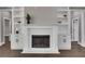Living room with white marble fireplace, built-in cabinets and shelving on either side at 2841 Bettis Ct, Marietta, GA 30066