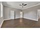 Spacious primary bedroom with hardwood floors, ceiling fan, and ensuite bathroom at 2841 Bettis Ct, Marietta, GA 30066