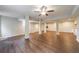 Open basement area featuring wood-look floors, a ceiling fan, and support columns at 3803 Butternut Dr, Decatur, GA 30034