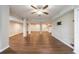 Partially finished basement with a kitchenette, wood-look flooring, and support columns at 3803 Butternut Dr, Decatur, GA 30034