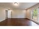 Spacious bedroom with hardwood floors and large windows offering wooded views at 3803 Butternut Dr, Decatur, GA 30034
