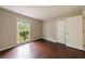 Bedroom with a large window bringing in natural light, and a double door closet at 3803 Butternut Dr, Decatur, GA 30034