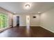 An expansive bedroom with hardwood flooring, multiple windows, and ensuite bathroom at 3803 Butternut Dr, Decatur, GA 30034