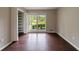 Bright bedroom with hardwood floors, large windows, and closet organizers at 3803 Butternut Dr, Decatur, GA 30034