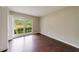 Well-lit bedroom featuring hardwood floors, natural light, and closet space at 3803 Butternut Dr, Decatur, GA 30034