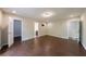 Spacious bedroom featuring hardwood flooring and multiple entry points at 3803 Butternut Dr, Decatur, GA 30034