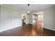 Open-concept dining room with hardwood floors flowing through into a kitchen space at 3803 Butternut Dr, Decatur, GA 30034