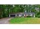 Charming single-story home with a lush green lawn and inviting curb appeal at 3803 Butternut Dr, Decatur, GA 30034