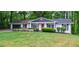 Charming single-story home with a lush green lawn and inviting curb appeal at 3803 Butternut Dr, Decatur, GA 30034