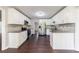 Updated kitchen featuring white cabinets, granite countertops, and stainless steel appliances at 3803 Butternut Dr, Decatur, GA 30034