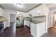 Charming kitchen featuring updated cabinets, granite countertops, and stainless steel appliances at 3803 Butternut Dr, Decatur, GA 30034