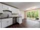 Open concept kitchen features stainless steel appliances and large window overlooking the backyard at 3803 Butternut Dr, Decatur, GA 30034