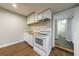 Kitchenette with white appliances, wooden countertop, and nearby bathroom at 3803 Butternut Dr, Decatur, GA 30034