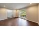 Bright living room with hardwood floors, large window, and neutral paint, ready for personalization at 3803 Butternut Dr, Decatur, GA 30034