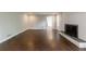 Expansive living room with hardwood floors, a fireplace, and an open layout, perfect for entertaining at 3803 Butternut Dr, Decatur, GA 30034