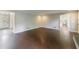 Spacious living room featuring hardwood floors and a bright, neutral color palette at 3803 Butternut Dr, Decatur, GA 30034