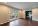 Bright living room featuring wood floors, recessed lighting, and a large window with neighborhood views at 3803 Butternut Dr, Decatur, GA 30034