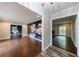 Open-concept living room with hardwood floors and accent wall, offering a modern touch at 3803 Butternut Dr, Decatur, GA 30034