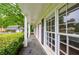 Covered porch with white columns, leading to the home's entrance and large window at 3803 Butternut Dr, Decatur, GA 30034