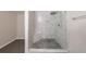 Contemporary marble tiled shower with glass enclosure and a built-in seat at 3803 Butternut Dr, Decatur, GA 30034