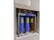 Close-up view of a water filtration system with multiple filter cartridges at 3803 Butternut Dr, Decatur, GA 30034