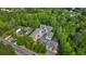 Aerial shot of the condo community surrounded by lush greenery and trees, plus road access at 404 Wade Creek Rd, Alpharetta, GA 30009