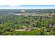 Aerial view of the property's location near Avalon, surrounded by lush greenery at 404 Wade Creek Rd, Alpharetta, GA 30009