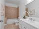This bathroom has a shower and tub, along with a white vanity and mirror at 404 Wade Creek Rd, Alpharetta, GA 30009