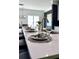 Bright kitchen island features bar seating, sleek countertops, and modern fixtures for a great cooking experience at 404 Wade Creek Rd, Alpharetta, GA 30009