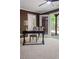This office has neutral carpet and a ceiling fan, with a patio door to the backyard at 404 Wade Creek Rd, Alpharetta, GA 30009