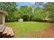 Large backyard includes a wooden deck with stairs and a storage shed, perfect for outdoor activities at 975 Shirley Se St, Smyrna, GA 30082