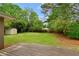 Large backyard includes a wooden deck and a storage shed, perfect for outdoor activities at 975 Shirley Se St, Smyrna, GA 30082