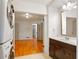 Bathroom features a stylish vanity and a stacked washer and dryer next to a doorway to the living space at 975 Shirley Se St, Smyrna, GA 30082