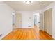 Hardwood floors, white walls, closet, and view to the hallway and bathroom at 975 Shirley Se St, Smyrna, GA 30082