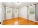 Bright bedroom with hardwood floors and lots of natural light from two windows at 975 Shirley Se St, Smyrna, GA 30082