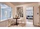 Cozy dining area with modern table set and view to a comfortable living room space at 975 Shirley Se St, Smyrna, GA 30082