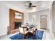 Charming dining room with fireplace, modern ceiling fan, and seating for six at 975 Shirley Se St, Smyrna, GA 30082