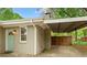 View of the exterior side door with carport in view at 975 Shirley Se St, Smyrna, GA 30082