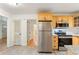Updated kitchen with stainless appliances and view to living area with hardwood floors at 975 Shirley Se St, Smyrna, GA 30082