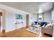 Bright living room featuring hardwood floors, neutral paint, and stylish furnishings at 975 Shirley Se St, Smyrna, GA 30082
