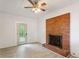 Living room featuring brick fireplace, neutral walls, and wood-look floors at 975 Shirley Se St, Smyrna, GA 30082