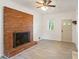 Inviting living room with brick fireplace, ceiling fan, and lots of natural light at 975 Shirley Se St, Smyrna, GA 30082