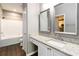 Bathroom with granite countertops, dual mirrors, and a shower-tub combo at 10 Ne Perimeter Summit Ne Blvd # 4428, Brookhaven, GA 30319