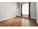 A spacious bedroom with hardwood floors, a ceiling fan, and large window at 10 Ne Perimeter Summit Ne Blvd # 4428, Brookhaven, GA 30319