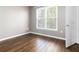 Bright bedroom with hardwood floors and a large window for natural light at 10 Ne Perimeter Summit Ne Blvd # 4428, Brookhaven, GA 30319